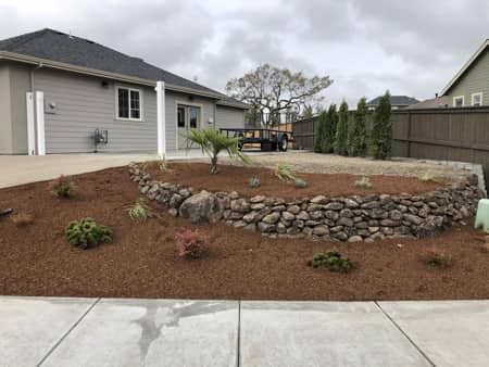 Natural rock landscaping in front yard