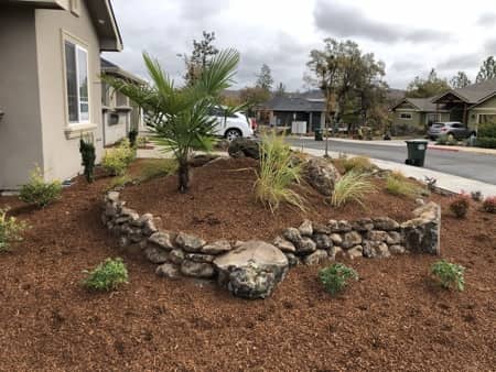 Natural rock landscaping in front yard