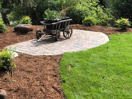 Paver patio in back yard with new sod