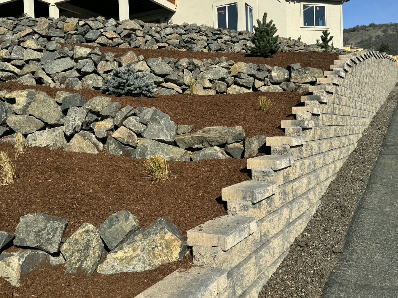 Front yard with multiple natural rock retaining wall